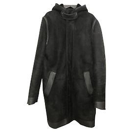 Givenchy hooded coat in black shearling lambskin with smooth leather insert in size 48 Ital. Black
