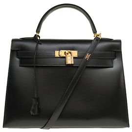 Exceptional Hermès Kelly handbag 32 saddle strap in box leather and gold-plated metal trim Black