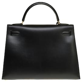 Hermès-Excepcional bolso de Hermès Kelly 32 correa de sillín en cuero box y adornos de metal dorado-Negro
