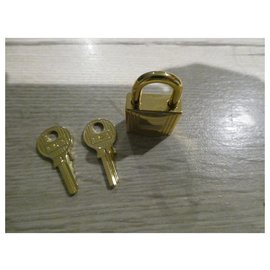 Hermès-Hermès golden steel padlock with 2 keys-Golden