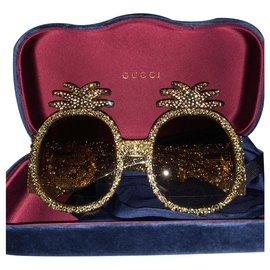 Gucci-Des lunettes de soleil-Bijouterie dorée