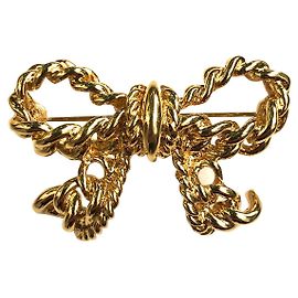 Nina Ricci Pins e spille D'oro
