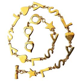 Yves Saint Laurent.  Collier YSL. Bijouterie dorée