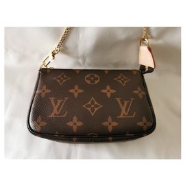 Louis Vuitton-bolsito para accesorios con mini monograma-Castaño