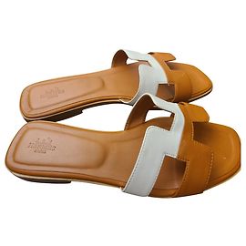Sandali Hermès Oran in pelle bianco e bronzo Bianco Bronzo