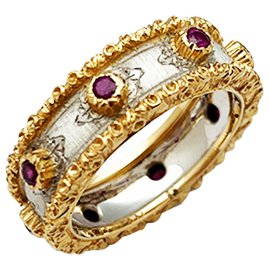 Buccellati bandeau ring,“Fusi”, two golds, ruby. Other