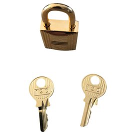 Hermès-Candado hermès nuevo acero dorado 2 llaves y bolsa para el polvo-Gold hardware