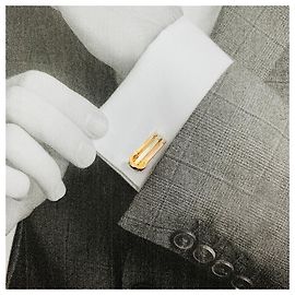 Three gold Cartier "C" cufflinks. Other