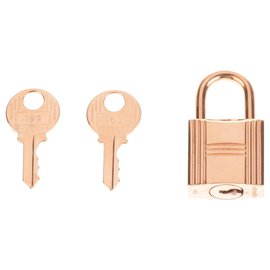 Hermès-Candado Hermès en metal dorado para bolsos Birkin o kelly, nueva condición con 2 llaves y bolsa original!-Dorado