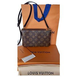 Louis Vuitton Pochette con zip foderata con monogramma Caramello