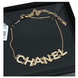 CHANEL Collier ras de cou or strass Bijouterie dorée