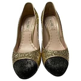 Miu Miu-Zapatos de tacón con puntera en dorado y purpurina dorada de Miu Miu-Dorado