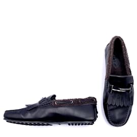 Tod's-Tod's loafers in black leather and brown shearling-Black