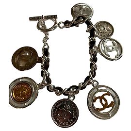 Bracelet breloques Chanel acier argent et doré Bijouterie argentée Bijouterie dorée