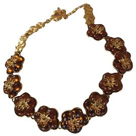 Kenzo Collier ras de cour, fleurs. Bijouterie dorée