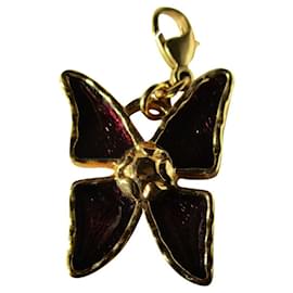 Bijou de sac papillon Yves Saint Laurent doré métal Doré