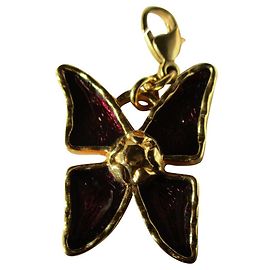 Portachina a farfalla Yves Saint Laurent oro metallo D'oro