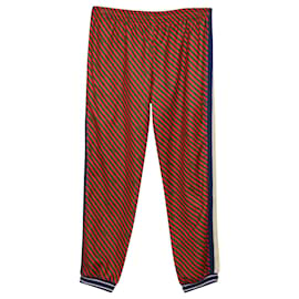 Gucci-Pantaloni della tuta Gucci a righe diagonali in poliestere rosso-Rosso