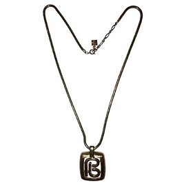PIERRE BALMAIN collier pendentif monogram Bijouterie dorée
