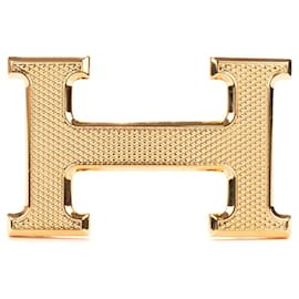 Hermès-Magnífica hebilla Hermès Constance Guilloche en metal dorado-Dorado