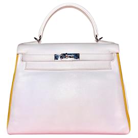 Hermès-A very special and rare two tone Kelly Retourne size 28 cm in White Epsom and Jaune Ambre and Palladium Hardware.-White