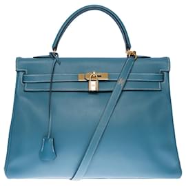Hermès-Stunning Hermes Kelly handbag 35 flipped Swift leather shoulder strap in Blue Jeans with white stitching , gold plated metal trim-Blue