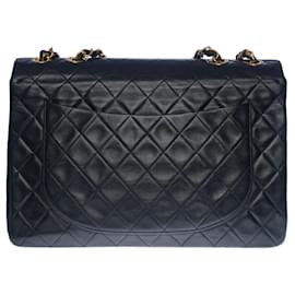 Chanel-Majestic Chanel Maxi Jumbo single flap bag in black quilted lambskin, gold metal trim-Black
