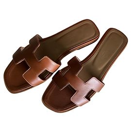 Hermès gold Oran mules Caramel