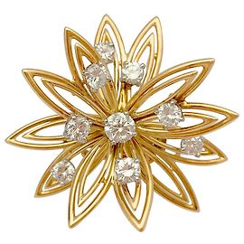 Spilla Cartier "Fiore" in oro giallo e diamanti. Altro