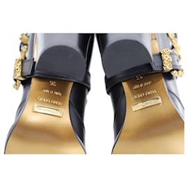 Dolce & Gabbana-Dolce & Gabbana Bottes hauteur genou avec boucle dorée en cuir noir-Noir