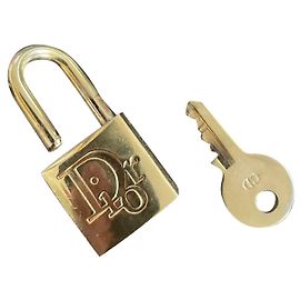Cadeado Dior dourado de aço Dourado