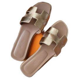 Hermès Oran sandals Metallic