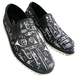 Dolce & Gabbana-Slip con estampado de trompeta en zapatillas bajas-Negro