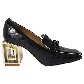 Tory Burch Jessa 75 Mocasines con tacón de metal en charol negro Negro