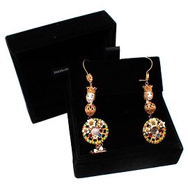 Dolce & Gabbana Boucles d'oreilles dorées poupée Pupi et roue de charrette Doré Métallisé
