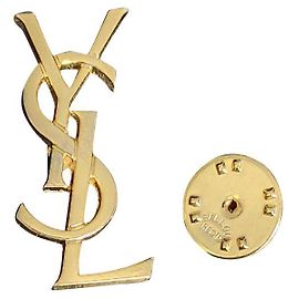 Yves Saint Laurent Broches et broches Doré
