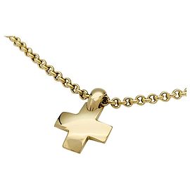 Pendente Pomellato "Croce" e catena in oro giallo. Altro