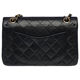 Chanel-The coveted Chanel Timeless bag 23 cm with lined flap in black quilted leather, garniture en métal doré-Black
