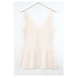 Chanel Spring 2012 Chaleco de punto con botones de perla y dobladillo peplum rosa Rosa