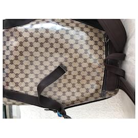 Gucci-Gucci GG bag for men and women in waxed canvas, leather and stainless steel-Brown