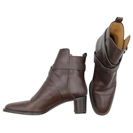 Hermès-Hermès ankle boots in brown leather with buckled ankle cross strap-Brown