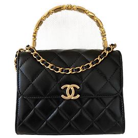 Chanel Black Lambskin with top handle flap bag Clutch Black