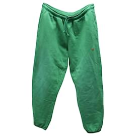 Acne-Pantaloni della tuta affusolati tinti in capo di Acne Studios in jersey di cotone verde-Verde