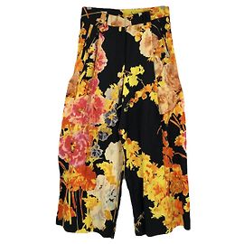 Calça Dries Van Noten em preto com mescla de algodão com estampa de flores rosa e amarelo Preto