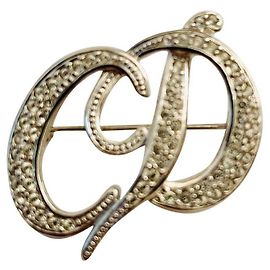 Broche com monograma Dior Prata