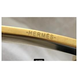 Hermès-Cuestionario negro con borde de latón dorado.-Negro