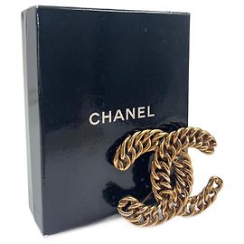 Broche Chanel CC dourado Dourado