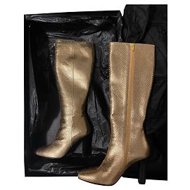Botas Saint Laurent de piel efecto pitón dorado Dorado