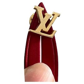 Épingles Louis Vuitton dorées en métal Doré