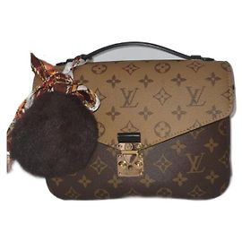 Louis Vuitton Pochette Metis Monogram Reverse Caramel Caramelo
